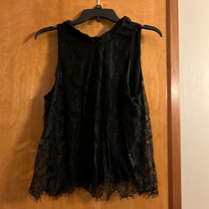 2-button neck closure. Lace overlay. Juniors large, fits adult S/XS